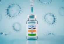 covid 19,coronavirus,vaccine,and,syringe,with,flag,of,india,concept